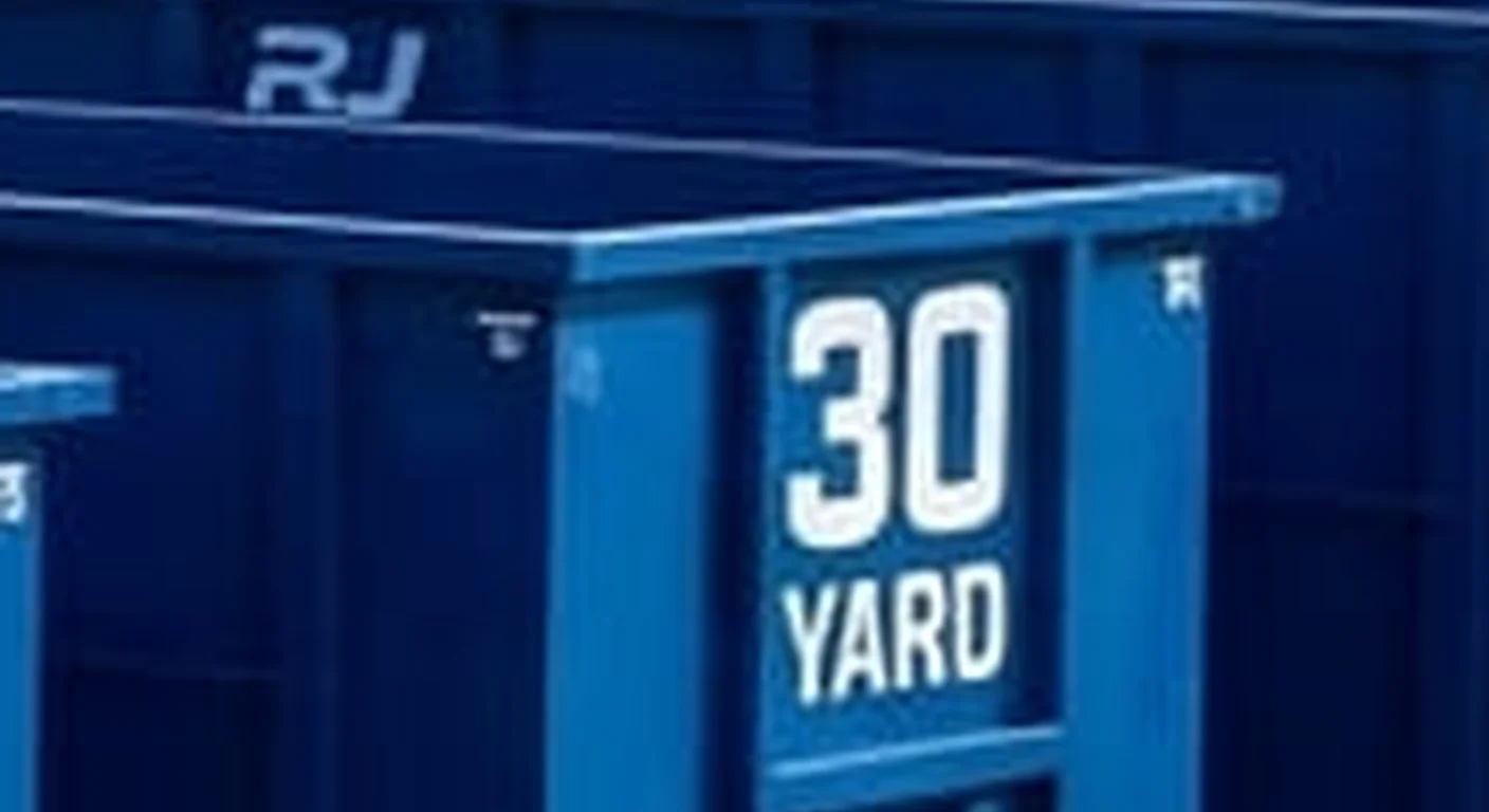 A clean, correctly-labeled 30 yard RJ Dumpster Rental Littleton roll-off container staged at the company yard, part of a five-container size lineup